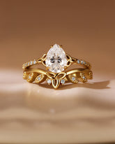 CANDICE Pear Shaped Moissanite Infinity Engagement Ring Set with Curved Wedding Band