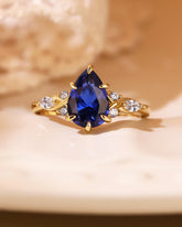 ELAIA Pear Cut Sapphire Twist Cluster Engagement Ring