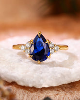 CYAN Pear Cut Blue Sapphire Cluster Engagement Ring