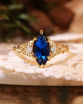 LUCILLE Marquise Cut Blue Sapphire Leaf & Knot Love Engagement Ring
