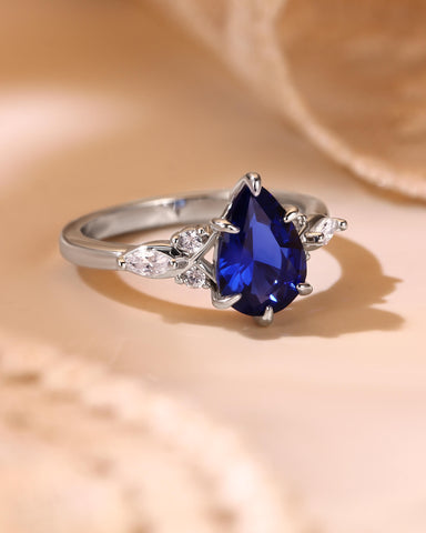 ELAIA Pear Cut Sapphire Twist Cluster Engagement Ring