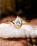 Philomela Sophisticated Bypass Claw Set Pear Solitaire Engagement Ring