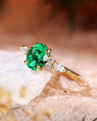 ILARIA Oval Cut Emerald Engagement Ring With Side Stone
