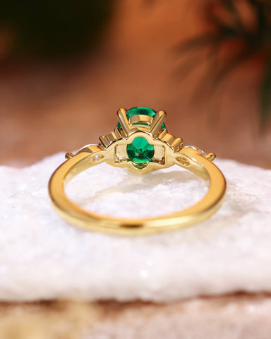 ILARIA Oval Cut Emerald Engagement Ring With Side Stone