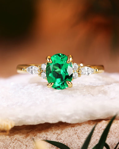 ILARIA Oval Cut Emerald Engagement Ring With Side Stone