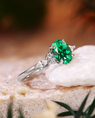 ILARIA Oval Cut Emerald Engagement Ring With Side Stone