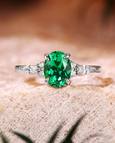 ILARIA Oval Cut Emerald Engagement Ring With Side Stone