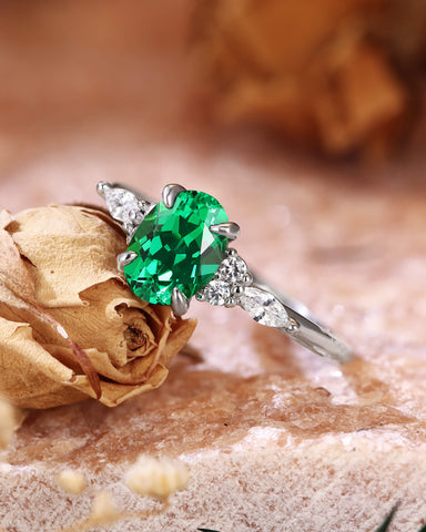 ILARIA Oval Cut Emerald Engagement Ring With Side Stone