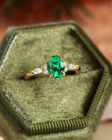 ILARIA Oval Cut Emerald Engagement Ring With Side Stone